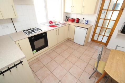 Bright kitchen with ample workspace and dining...