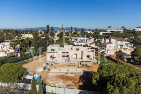 Aerial construction view of a luxury contemporary villa on an elevated plot in Salicos Carvoeiro Algarve