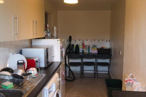 A functional kitchen equipped with essential ap...