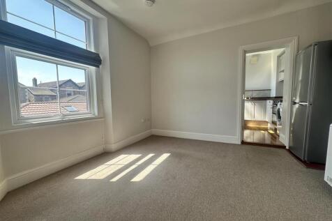 Bright and airy bedroom with large windows...