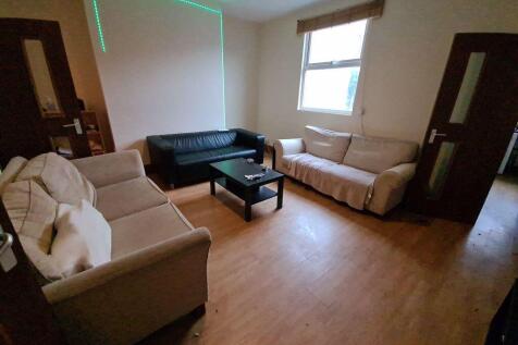 A cozy living room featuring a combination of t...