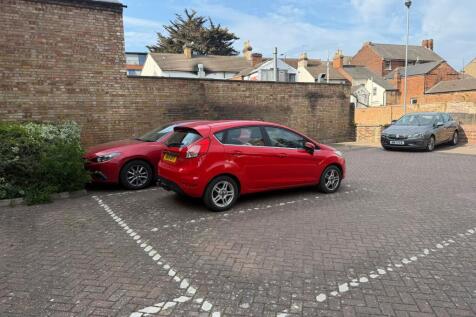 Allocated Parking where the red car is parked