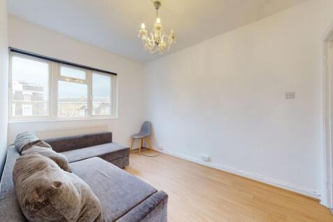 Bright living area with stylish chandelier...