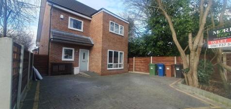 Modern detached home with large paved driveway...