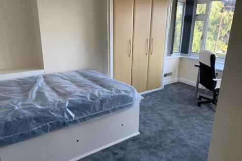 Bright and well-maintained bedroom featuring a ...