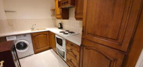 Bright kitchen with classic wooden cabinets...