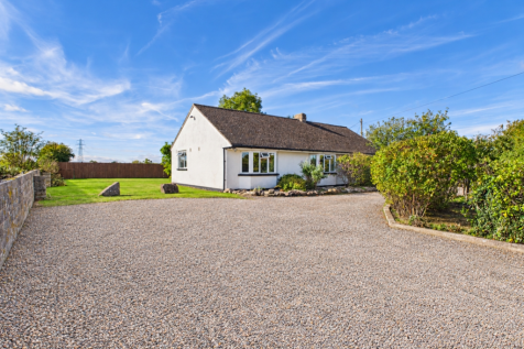 Bright, weed-free gravel driveway