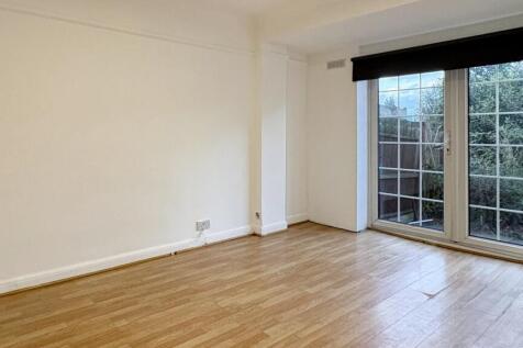 Bright, modern living room with wide floor-to-c...