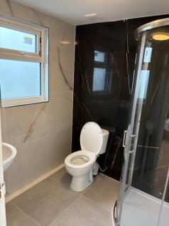 Modern bathroom with stylish marble effect tile...