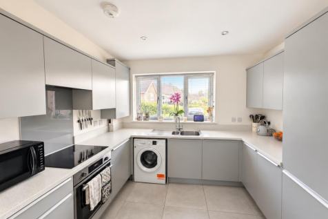 Modern Grey U-Shaped Kitchen Interior.png