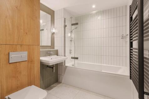 Experience luxury in this elegantly designed modern bathroom.