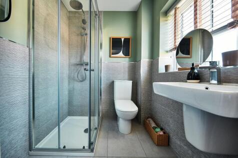 The main bedroom boasts its own en-suite shower room