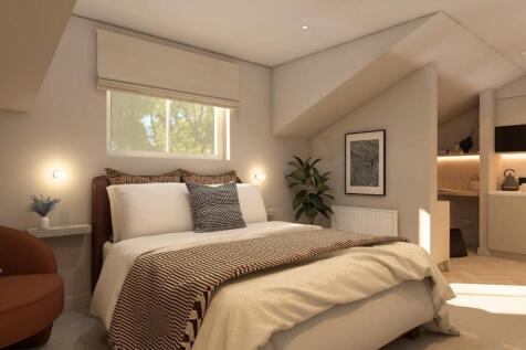 Stylish modern suite with a sleek kitchen area...