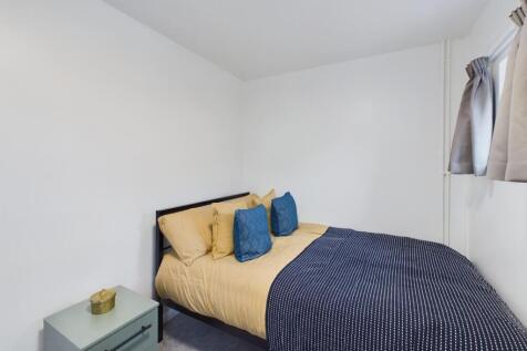 A stylish and inviting double bedroom featuring...