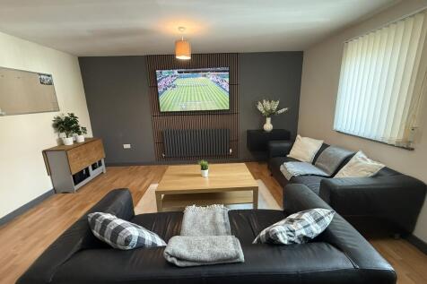 Living Area with 65 Inch Media Wall