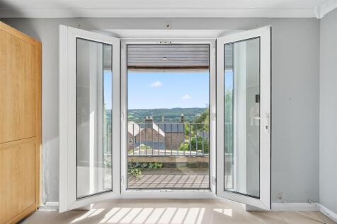 Bedroom One - balcony doors open.jpg