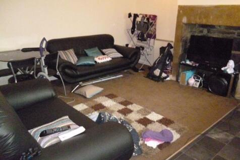 Cozy living room with leather sofas, a central ...