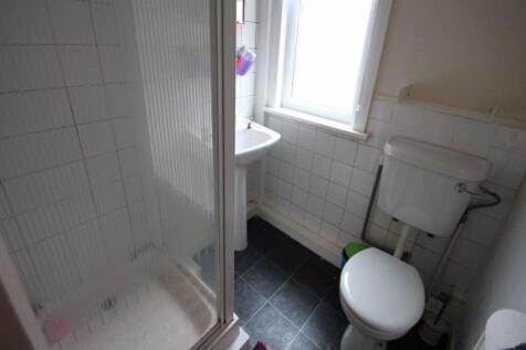 A clean and functional bathroom with a toilet a...