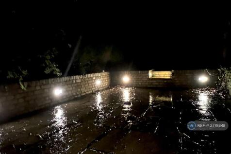 Rainy Lit Patio Off Dining Area