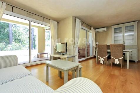 Bright living room with sliding doors opening to t