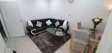Modern lounge with corner sofa and dining area...