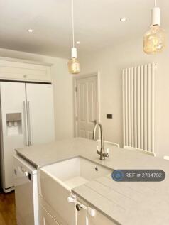 Belfast Sink With American Fridge Freezer .