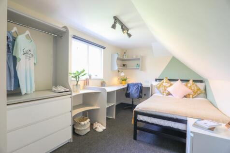 Bright and well-maintained bedroom featuring a ...