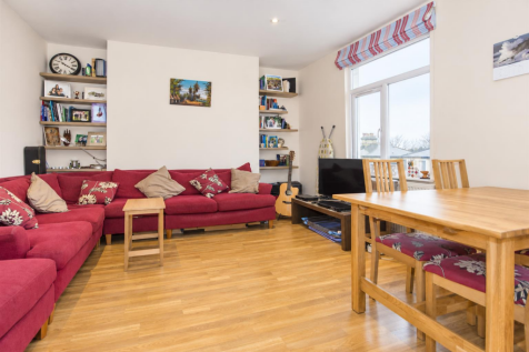 Bright Red Sofa Living and Dining Room.png