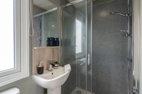 Modern Bathroom With Glass Shower Enclosure And Wa