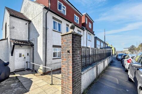 Bright exterior view of a multi-storey house...