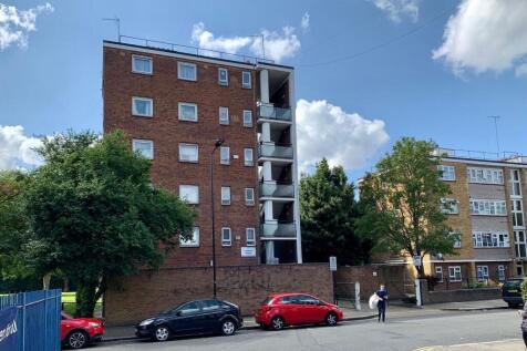 Modern apartment block under a bright blue sky...