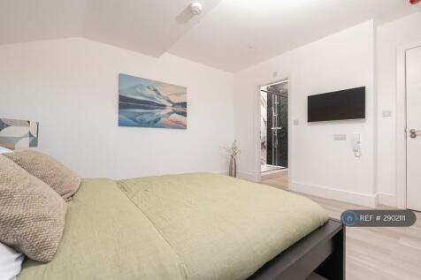 Contemporary Bedroom With Wall-Mounted Smart Tv