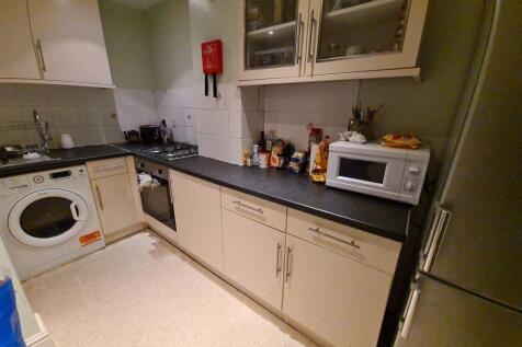 A functional and tidy kitchen area featuring a ...