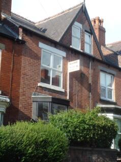 Exterior view of a traditional brick house with...