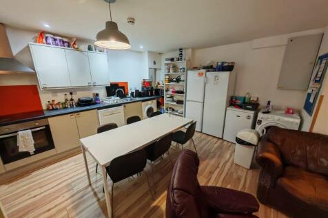 Spacious open-plan kitchen with dining area...