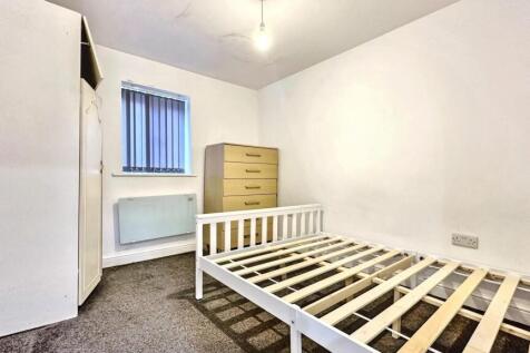 Bright bedroom with ample storage and double be...