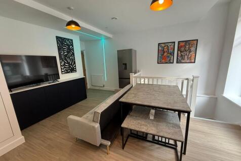 Contemporary open-plan living area with a large...