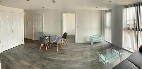 Bright open-plan lounge with dining area...