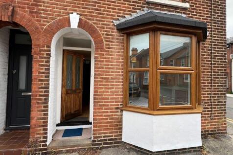 Charming red brick exterior with bay window...
