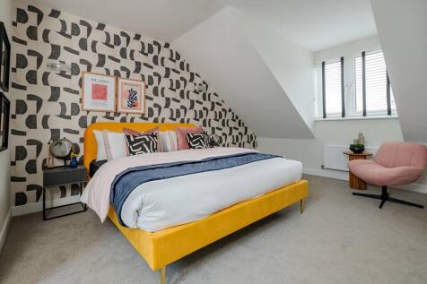 Bedroom 2 is a spacious room that spreads across the whole top floor