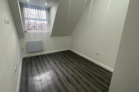 Bright, freshly painted single bedroom with mod...