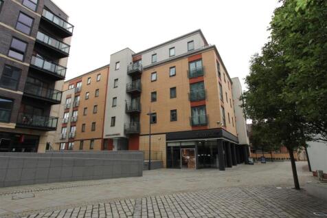 Modern apartment building with sleek balconies...