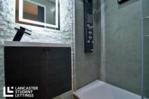 Ultra-modern shower room with sleek LED mirror...
