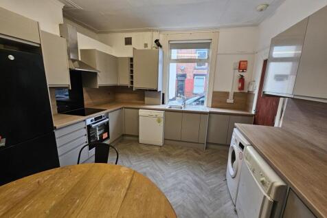 A functional kitchen area featuring essential a...