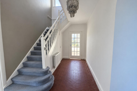Bright Greige Hallway with Staircase - 3 Richmond 