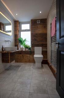 Modern bathroom with stylish wood accents...
