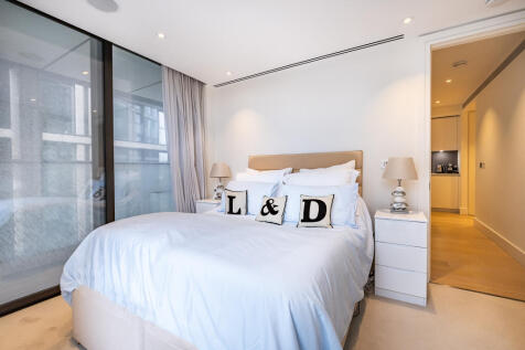 Bedroom with built in storage and balcony access