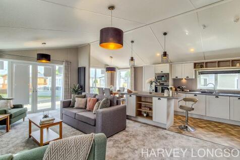 Open-plan lounge and kitchen inside the Sunseeker 