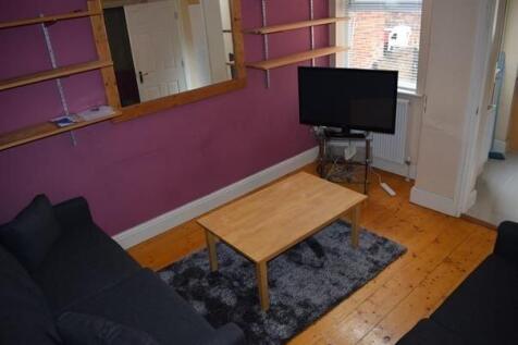 Comfortable living room with two sofas facing a...