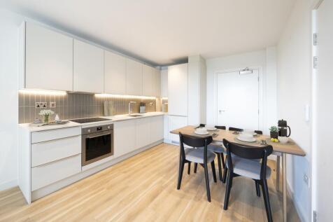 Step into a bright, stylish kitchen that combines functionality with modern elegance.